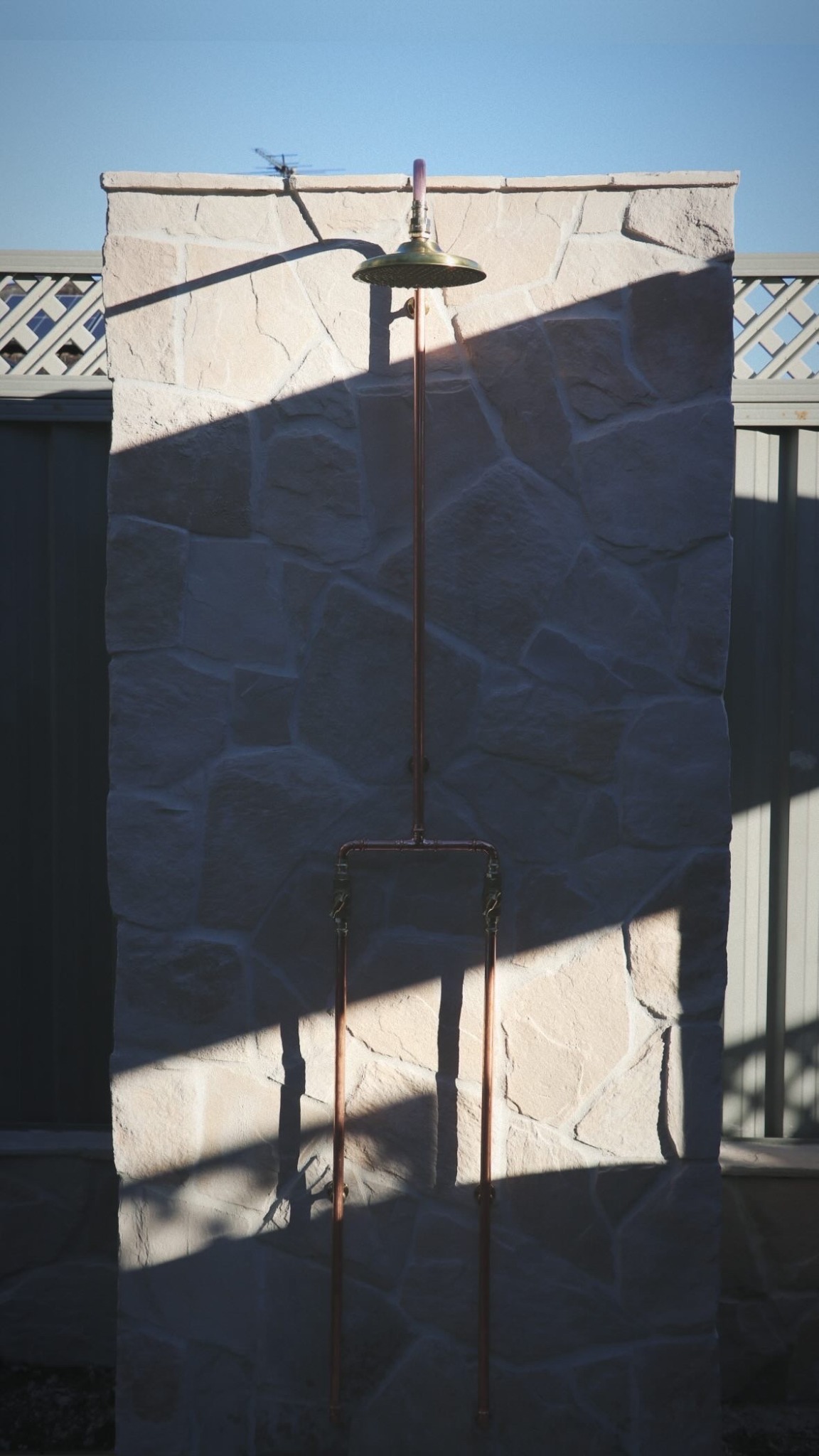 Custom exposed copper outdoor shower installation